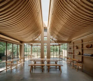A minimalist restaurant interior featuring wood as the main material.