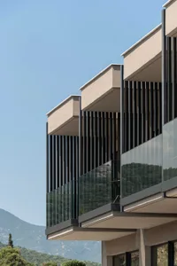 A modern building with glass and concrete exteriors.
