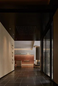 Modern lobby interior with concrete walls and glass walls and doors