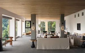 Modern living room featuring concrete and wood materials