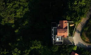 Aerial view of a modern residential home with a brick exterior.