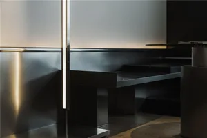 Modern restaurant interior featuring metallic seating and sleek, minimalist design.