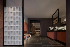 Concrete tiles and wooden elements in a restaurant interior design.