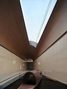 Modern architectural space with indoor water feature and boat