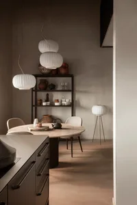Contemporary room with modern furniture, concrete walls, and minimalist decor.