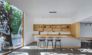 Modern kitchen with minimalist design and wooden finishes