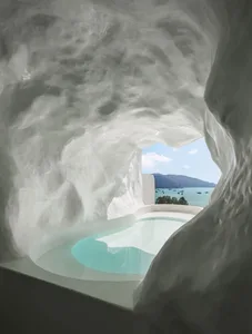 Concrete spa suite with a view of the sea and mountains