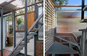 Metal stairway with industrial design elements in an outdoor setting.