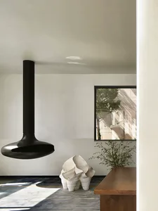 Modern minimalist interior design featuring wooden elements and sleek, contemporary furniture.