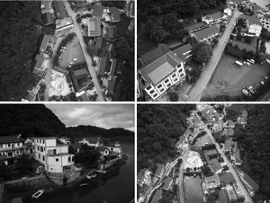 Aerial view of a village with various buildings and roads.
