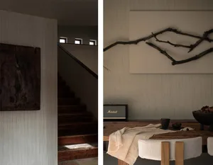 Modern interior space featuring a staircase with wooden steps and railings, minimalist design.