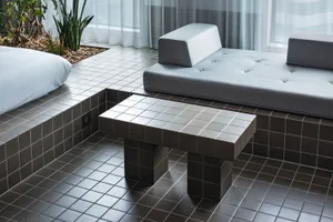 A minimalist interior design featuring subway tiles.
