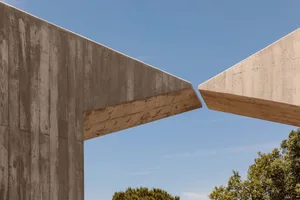Concrete architectural structure with overlapping elements.