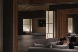 Modern hotel lobby featuring contemporary furniture and lighting.