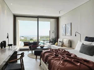Modern residential interior with wood, glass, and concrete elements.