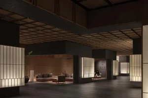 A modern lobby interior with concrete walls and a minimalist design.