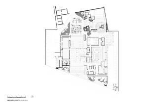 Floor plan of a modern commercial space featuring concrete, glass, and steel materials.