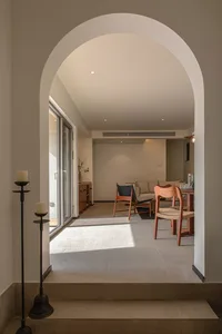 Architectural interior design featuring minimalist living room with concrete elements.