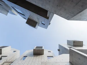 A modern building constructed primarily of concrete with a minimalist design.
