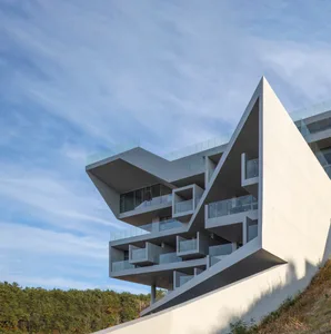 Exterior view of a modern, concrete, angular building.