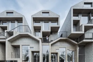 A modern, residential architectural design featuring stack houses constructed from concrete.