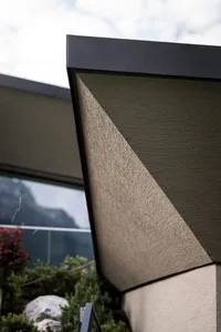 Modern house exterior with concrete facade and angular architectural design
