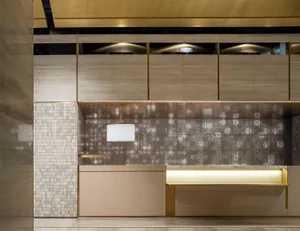 Modern interior of a hotel reception featuring wood and terrazzo materials.