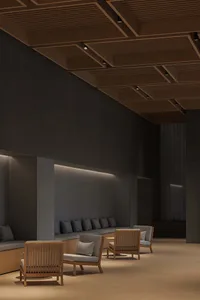 A modern lobby interior with concrete walls and floors.