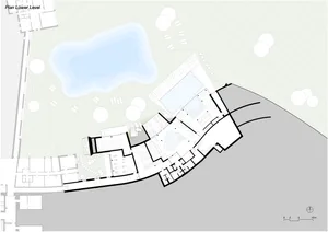 Floor plan of a modern residential building with concrete and glass materials.