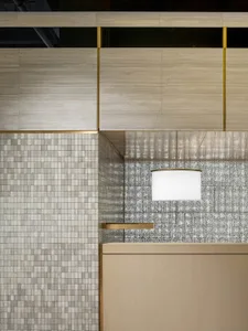 Modern retail interior featuring a mix of tile materials with a minimalist design.