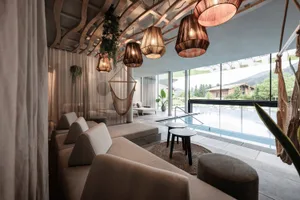 A modern spa interior with concrete, fabric, and glass materials.