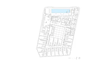 A detailed blueprint of an office space layout on a paper sheet, showing various rooms and their arrangement.