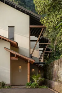 Modern building with concrete stairs in a forested area.