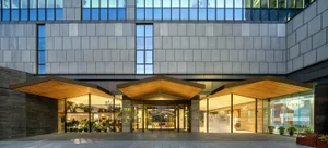 Modern commercial interior with glass and concrete materials.