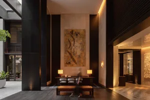 A modern industrial lobby with concrete and glass materials