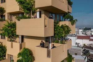 High-rise apartments featuring green vegetation and concrete structures.
