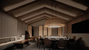 Industrial-style lounge and dining area featuring wood furniture and decorative woven lighting.