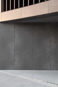 A minimalist, modern architectural exterior with clean concrete panels.
