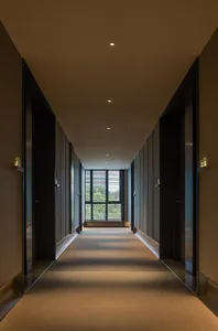 A modern indoor corridor with brick ceiling and floor.