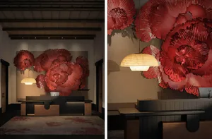 A modern lobby featuring red floral decor and wood furniture.
