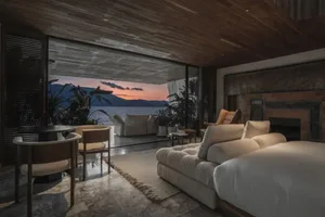 Modern residential space featuring stone and wood materials