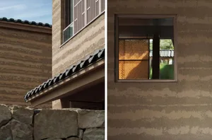 An architectural exterior featuring sandstone walls and tiled roof.