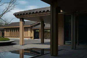 A minimalist architectural structure with wooden materials.
