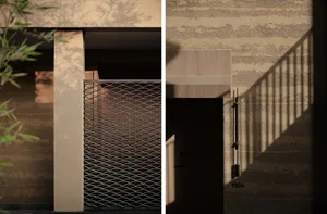 Modern building with a concrete gate and shadow on the wall