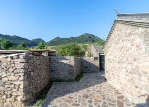 A stone pathway in a village setting.