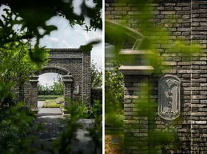A brick gateway surrounded by lush greenery and plants, with a clear path leading through it.