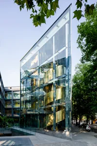 Modern architectural building featuring glass and concrete materials.