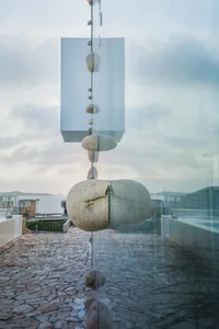 A modern installation featuring stones of natural materials arranged in a minimalist design.