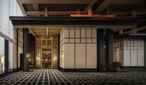 Modern lobby with black and white patterned tiles, wooden columns, glass walls, and stone accents.