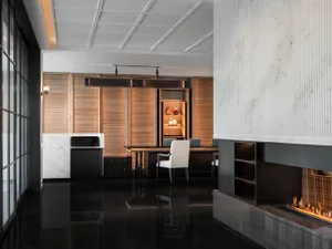 Contemporary minimalist office space with a conference room featuring modern materials and sleek design.